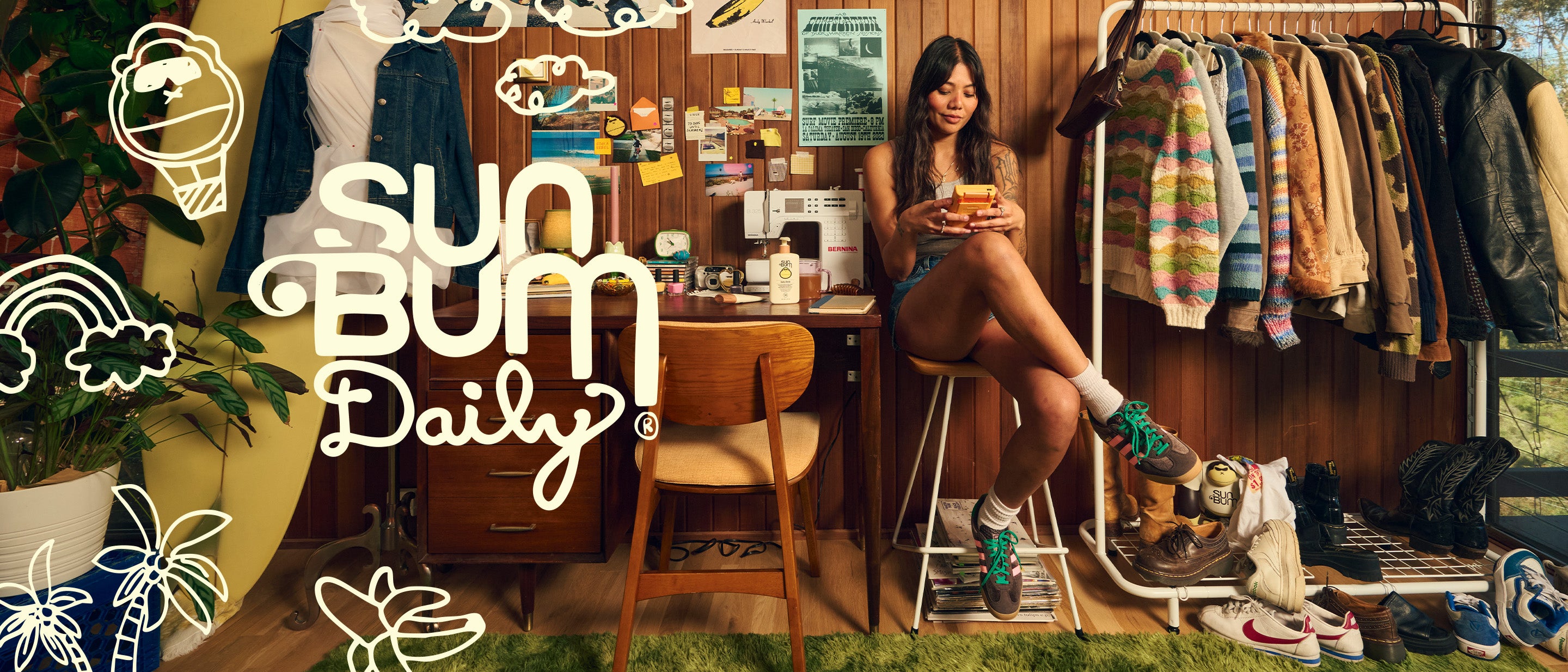 Girl sitting in a messy room playing a gameboy with "Sun Bum Daily" text